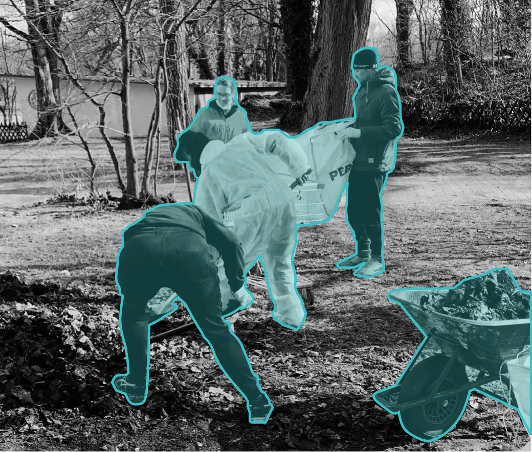 Volunteers working on the grounds with a wheelbarrow, marked in teal